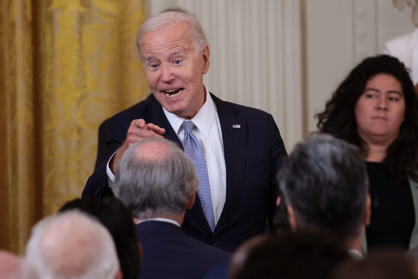 President Joe Biden greets audience members during an event