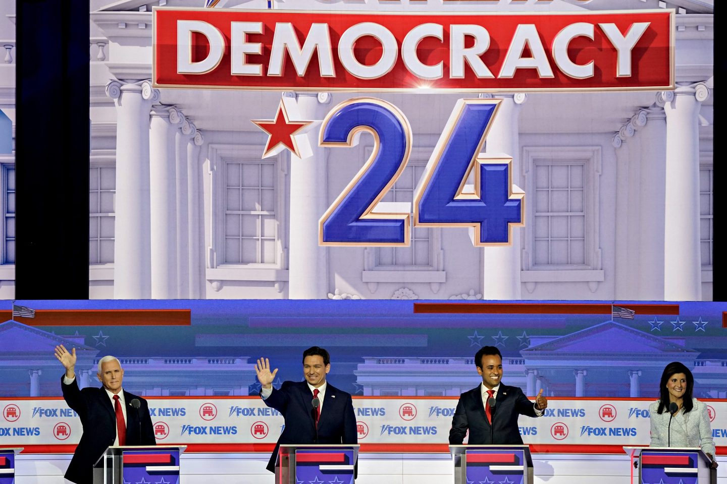 Mike Pence, Ron DeSantis, Vivek Ramaswamy, and Nikki Haley greet the audience during the debate hosted by Fox News in Milwaukee on Aug. 23.