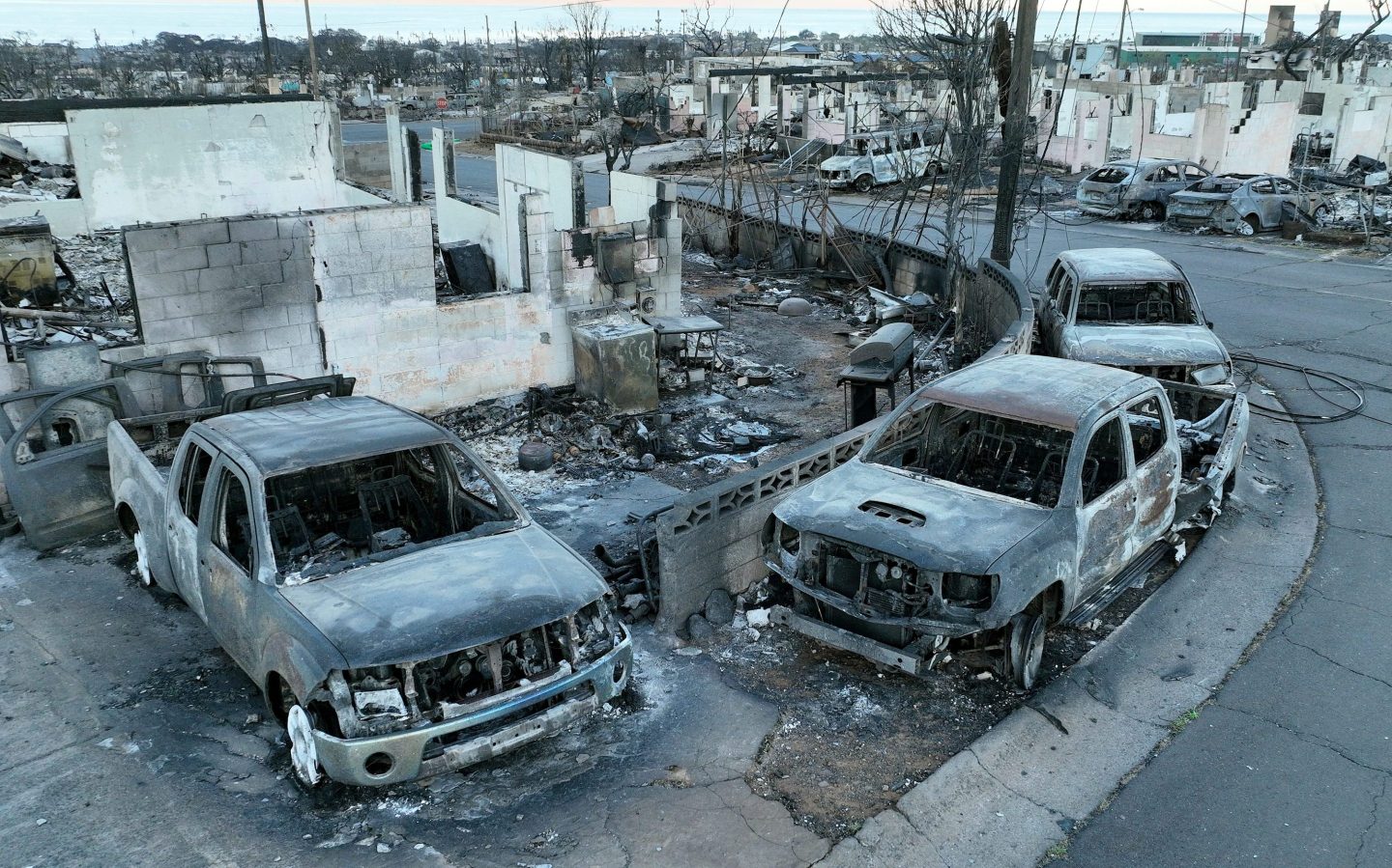 Burned cars and homes are seen in a neighborhood that was destroyed by a wildfire on Aug. 18, 2023 in Lahaina, Hawaii.