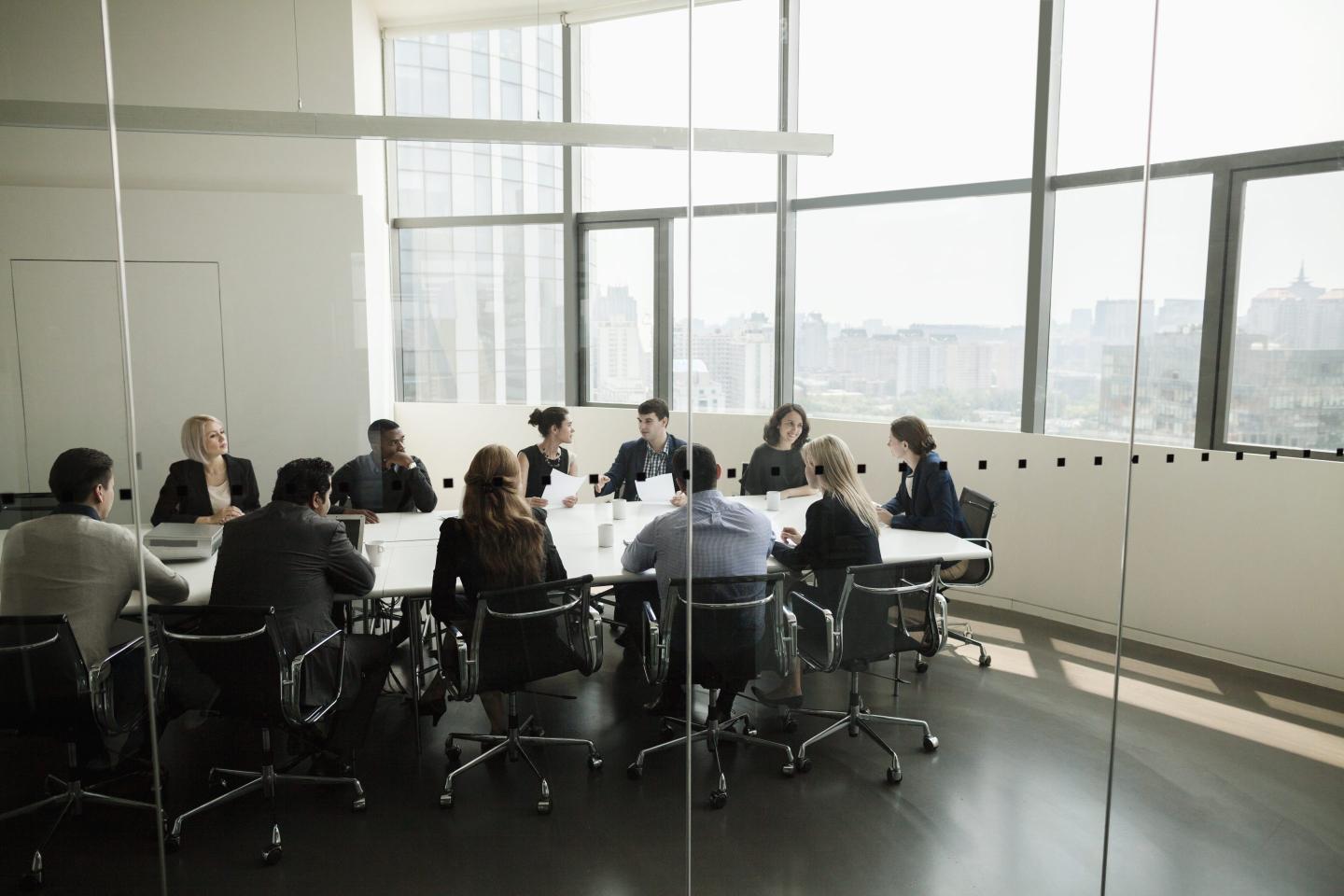 Business people sitting in a boardroom.