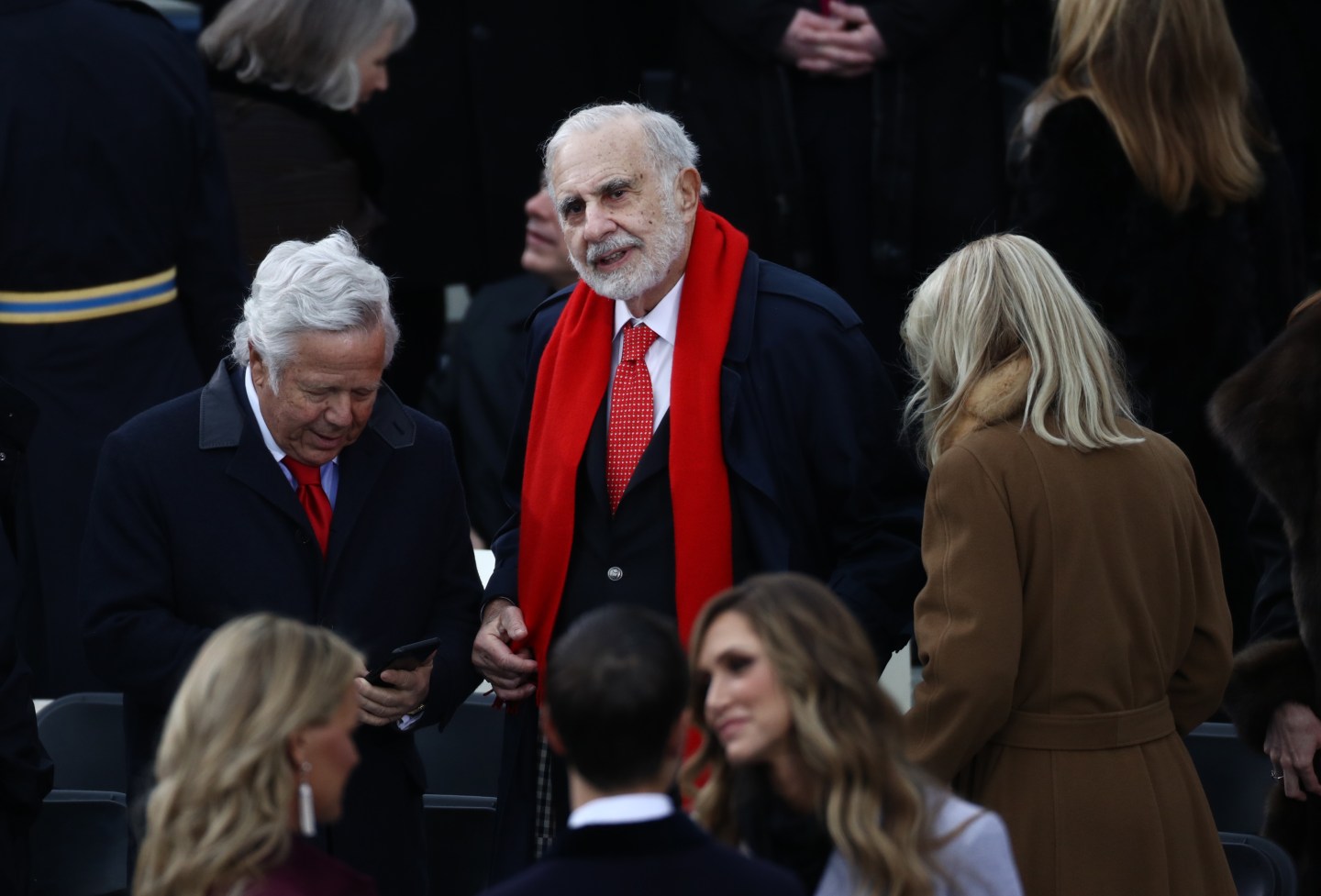 Billionaire activist investor Carl Icahn, center.