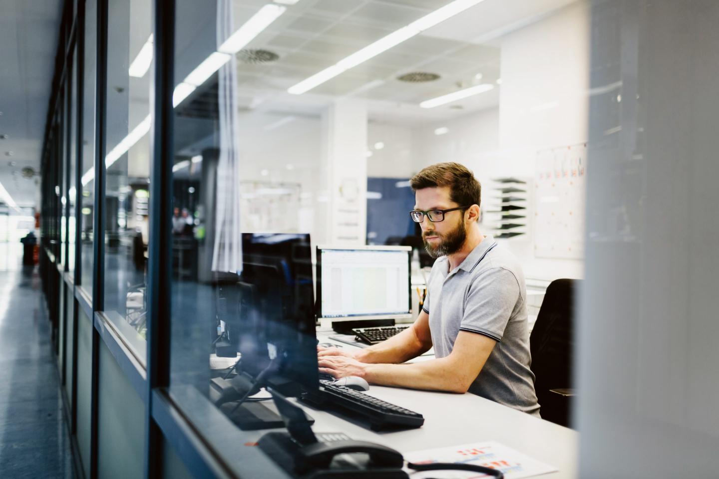 man at computer desk