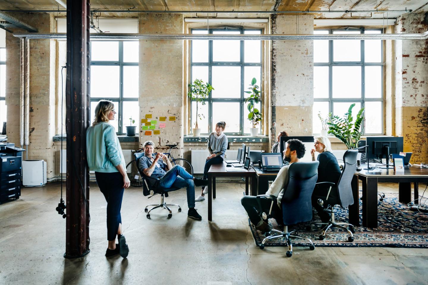 WeWork struggles as the era of open floor plans and hustle culture comes to a close.