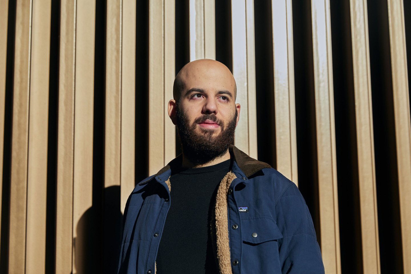 Johnny Boufarhat, bearded man wearing a blue jacket