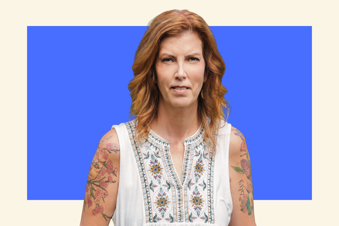 Woman with wavy hair looking into camera