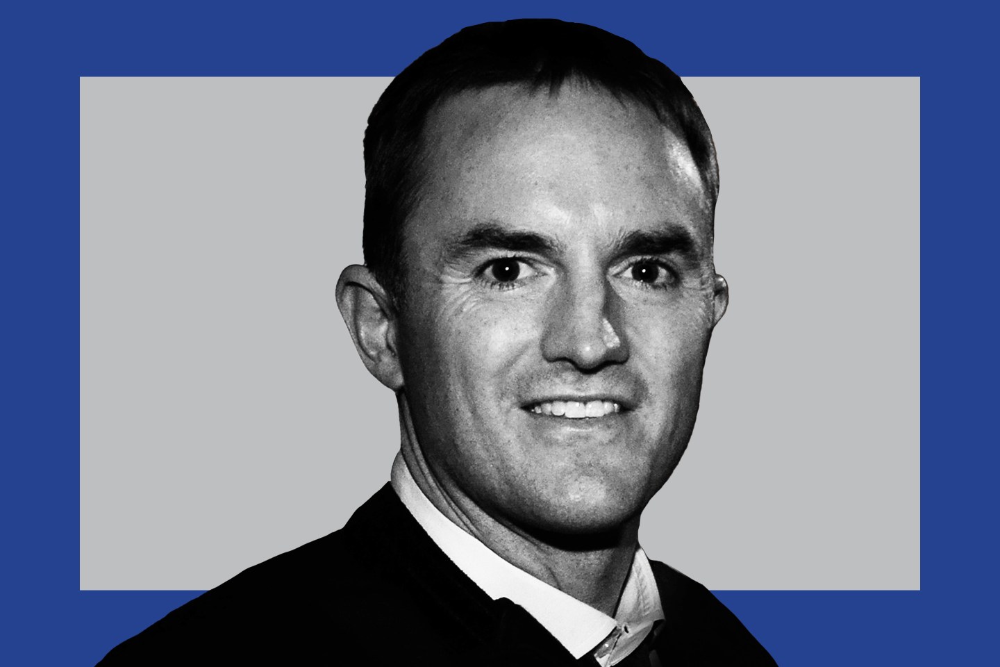 man in professional clothing, smiling