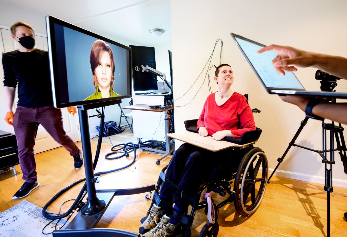 Woman in wheelchair interacting with a screen