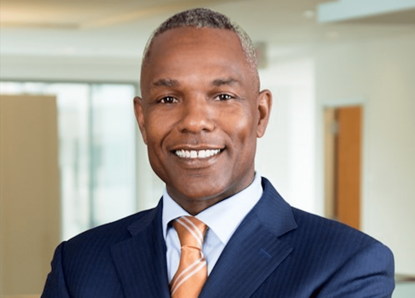 Businessman looking out of office window, rear view