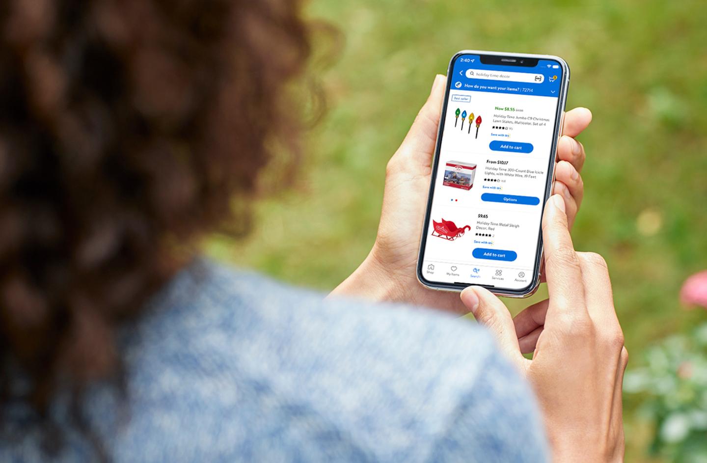 A customer shops on Walmart.com via mobile phone.