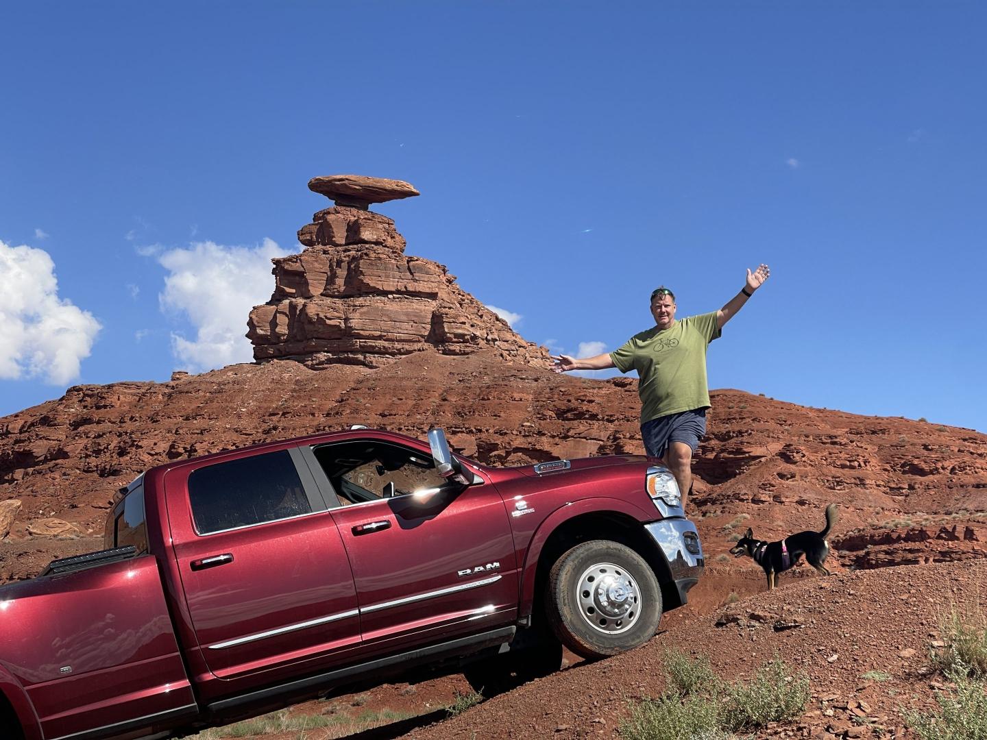 Photo of Chris Miller next to his truck on a trip