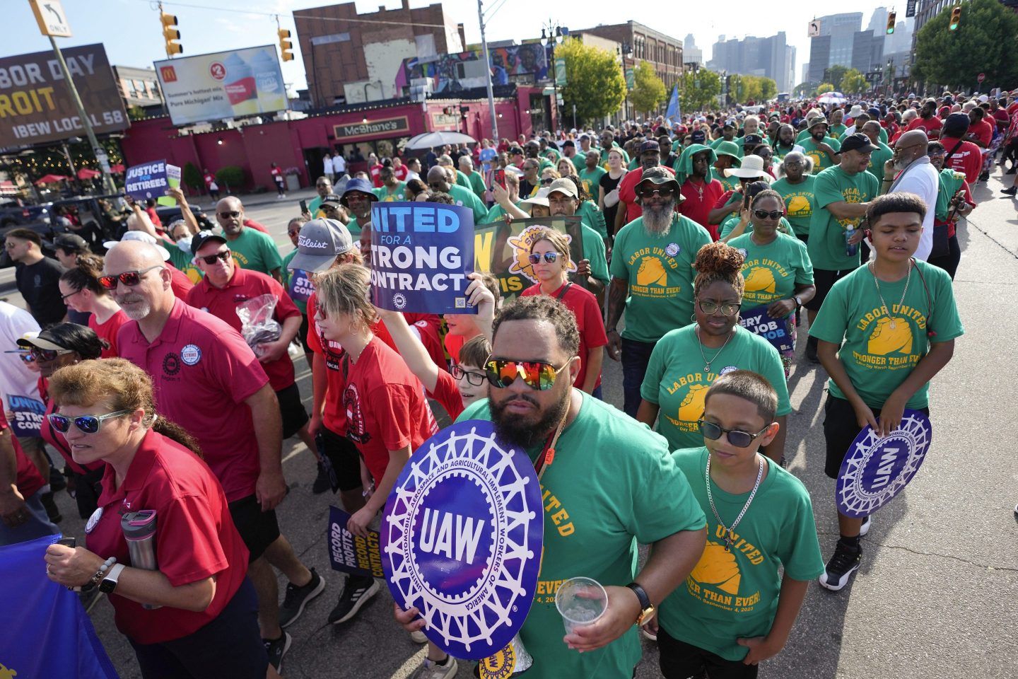United Auto Workers members walk in the Labor Day parade in Detroit on Sept. 4, 2023. The union is threatening to strike any automaker that hasn't reached an agreement by the time contracts expire on Sept. 14.