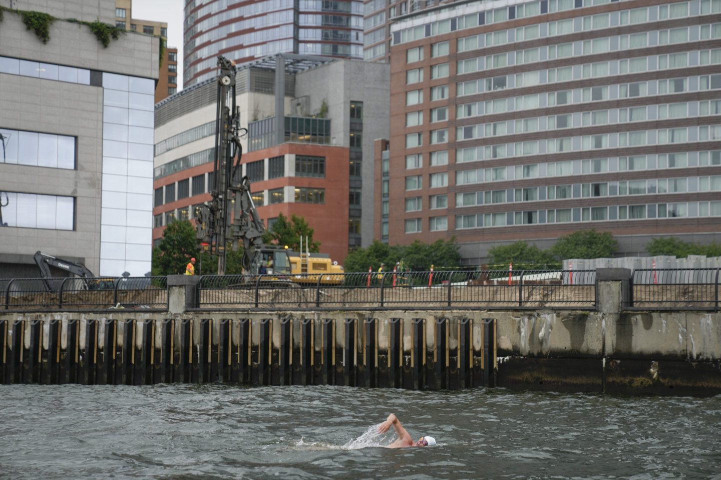 Long shot of a swimmer in lower Manhattan
