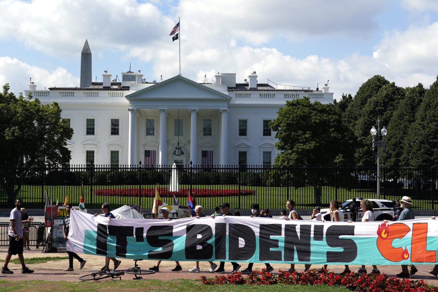 Climate activists rally in front of the White House at Lafayette Square to demand that President Joe Biden declare a climate emergency and move the country rapidly away from fossil fuels on July 4, 2023, in Washington.