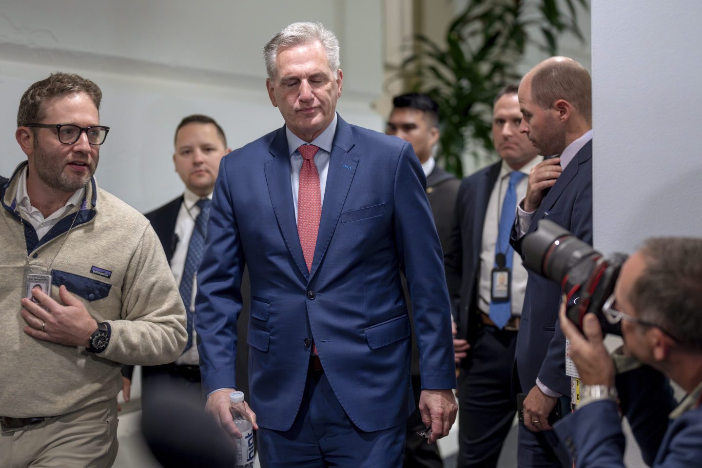 Speaker of the House Kevin McCarthy, R-Calif., emerges from a closed-door Republican strategy session to talk to reporters about updates on funding the government and averting a shutdown, at the Capitol in Washington, on Sept. 27, 2023.