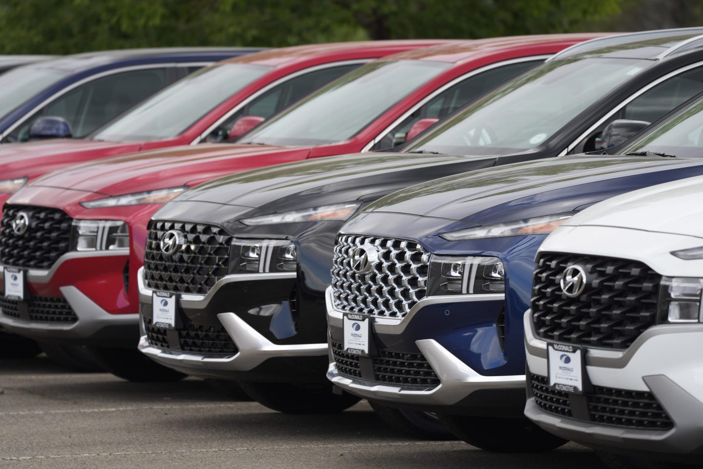 A line of 2022 Santa Fe SUV's sit outside a Hyundai dealership on Sept. 12, 2021, in Littleton, Colo.