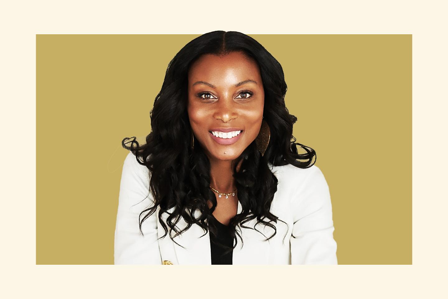 woman smiling and wearing white suit jacket