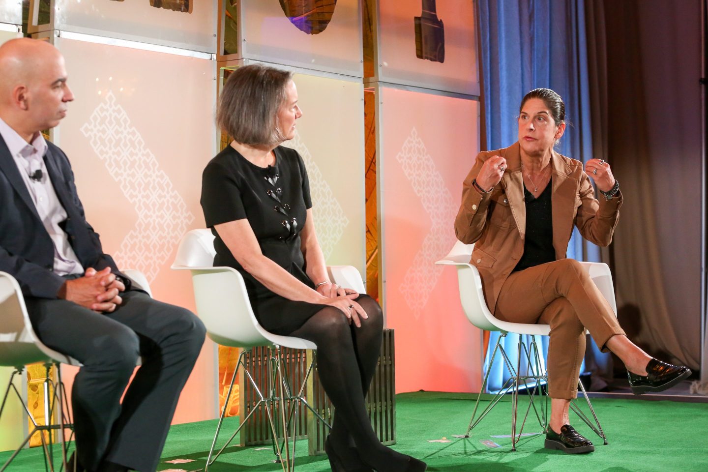 professionals sitting and talking onstage