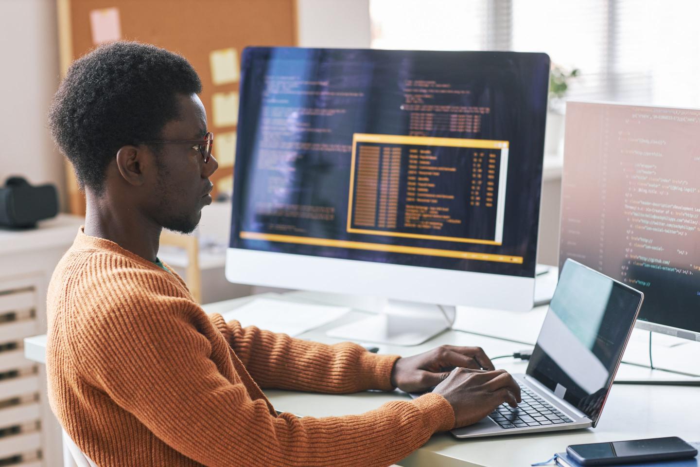Young Man Concentrated on Coding
