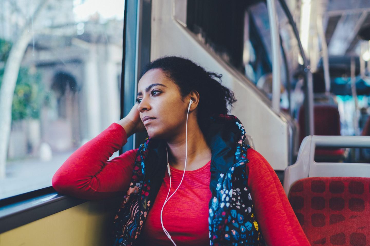 woman on bus looking forlorn