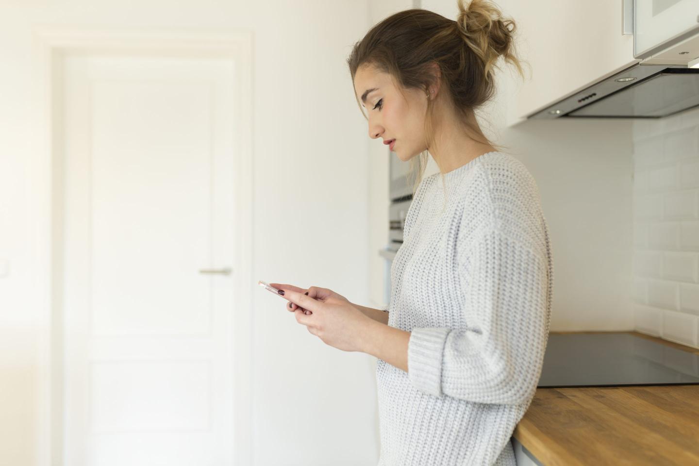 Woman staring at phone