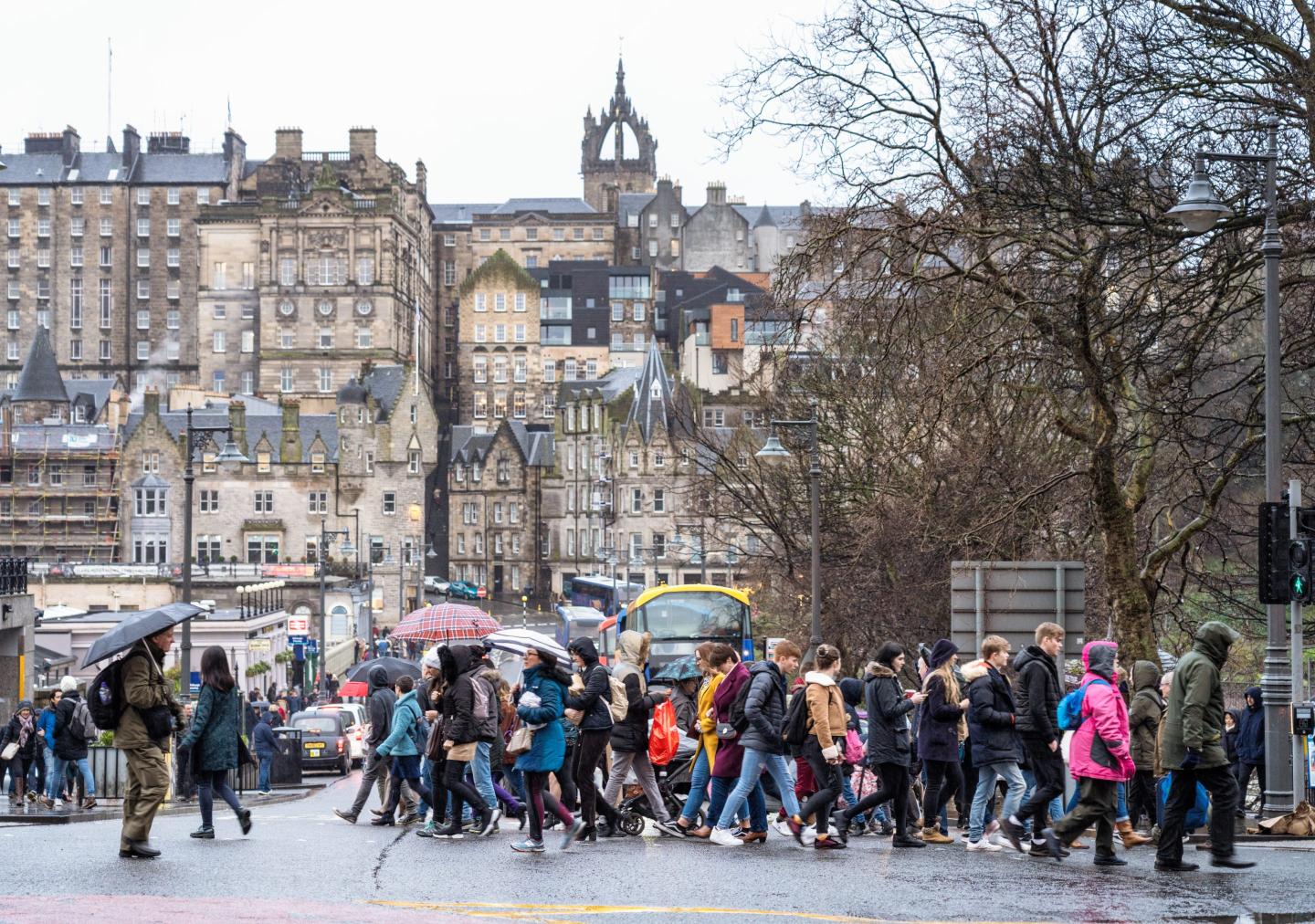 people walking on a busy street in Scotland