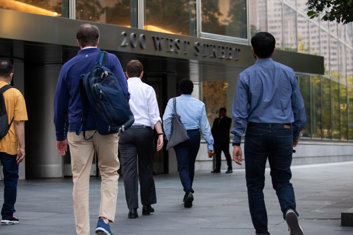 business professionals entering an office building