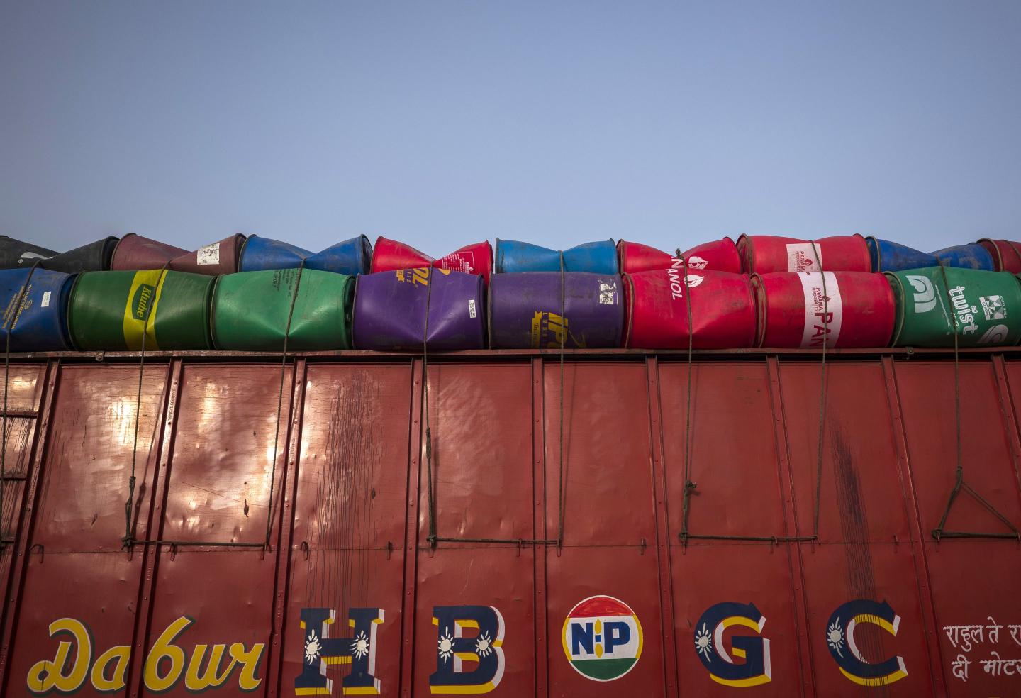 Oil barrels loaded on a truck in Faridabad, India, on Sunday, June 12, 2022. 