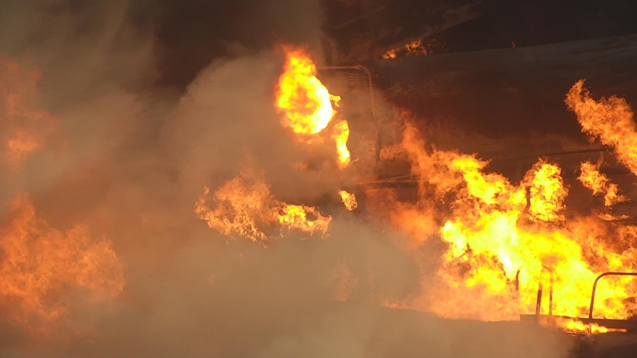 Smoke and flames rise after after the train derailment in East Palestine, Ohio.
