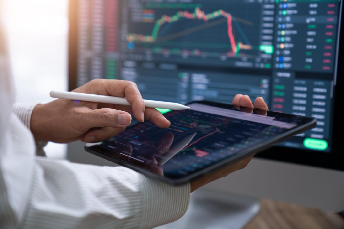 Business Investor buying stock ,cryptocurrency, bitcoin, through mobile app
