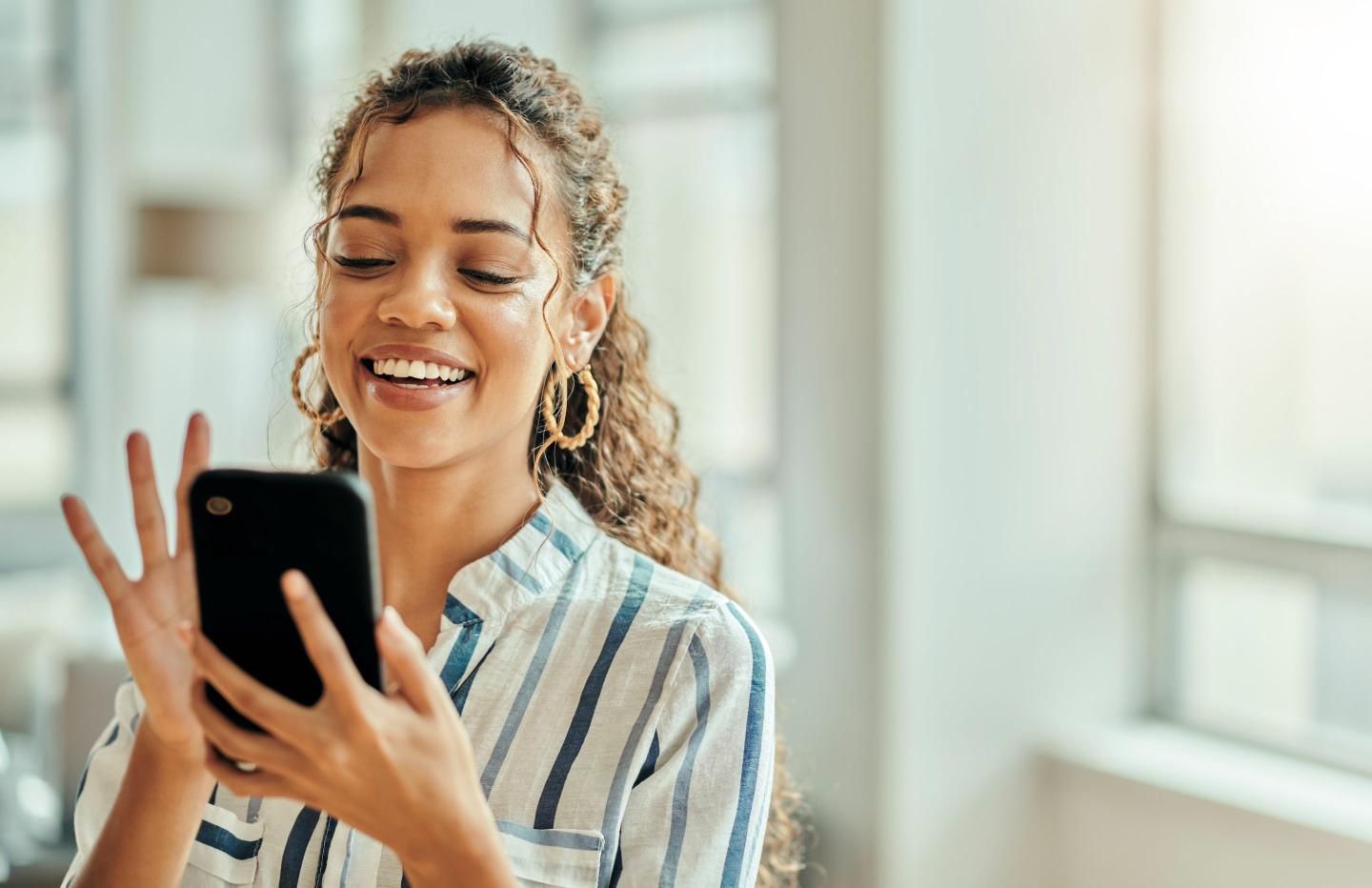 Young woman texting on her phone