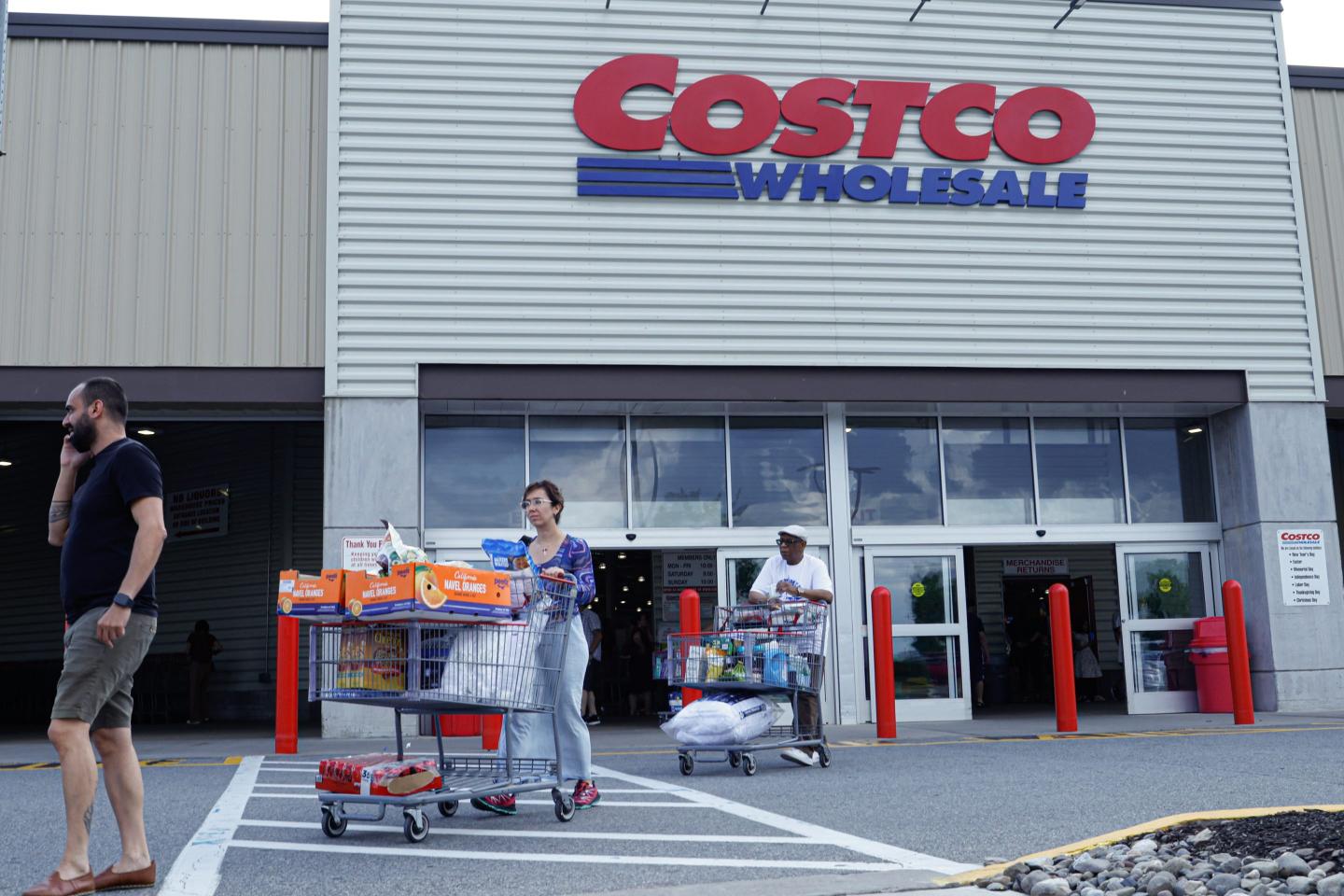 Customers exit a Costco store on June 28, 2023 in Teterboro, New Jersey.