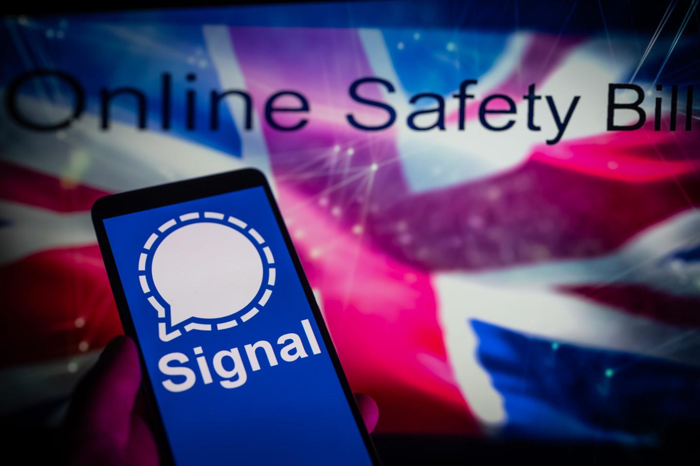 Signal app displayed on a mobile with in the background U.K flag with online safety bill seen on screen, in this photo illustration, on August 14, 2023 in Brussels, Belgium.