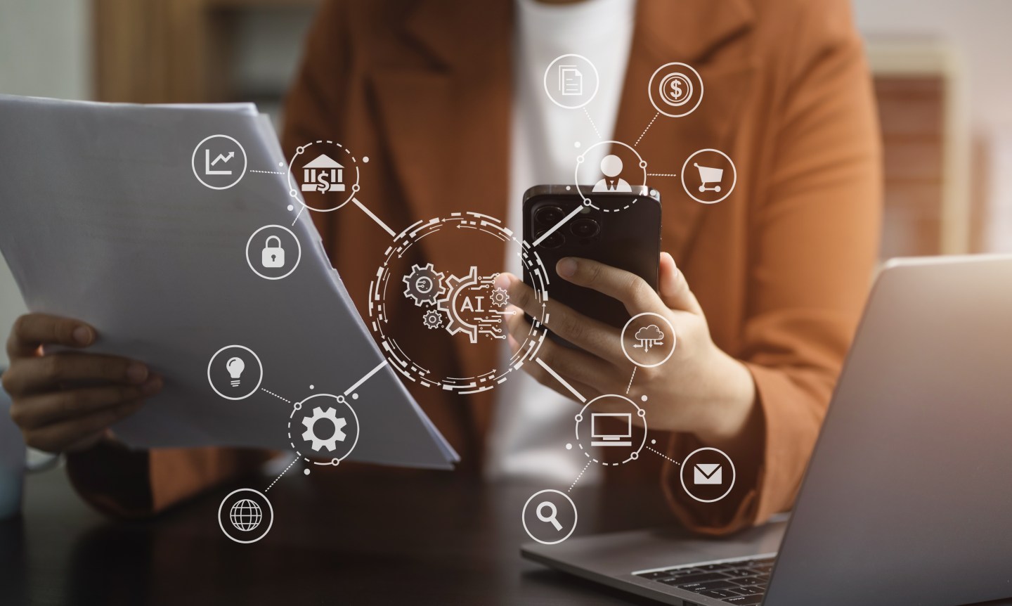 woman holding phone and paperwork looking at data