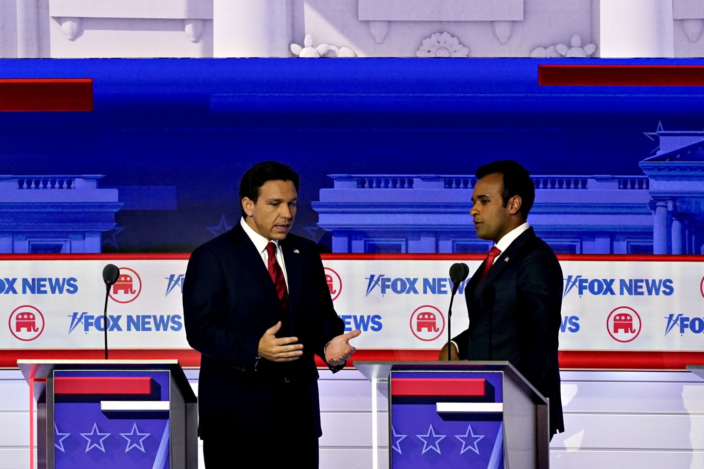 Ron DeSantis speaks to Vivek Ramaswamy at the first Republican debate.