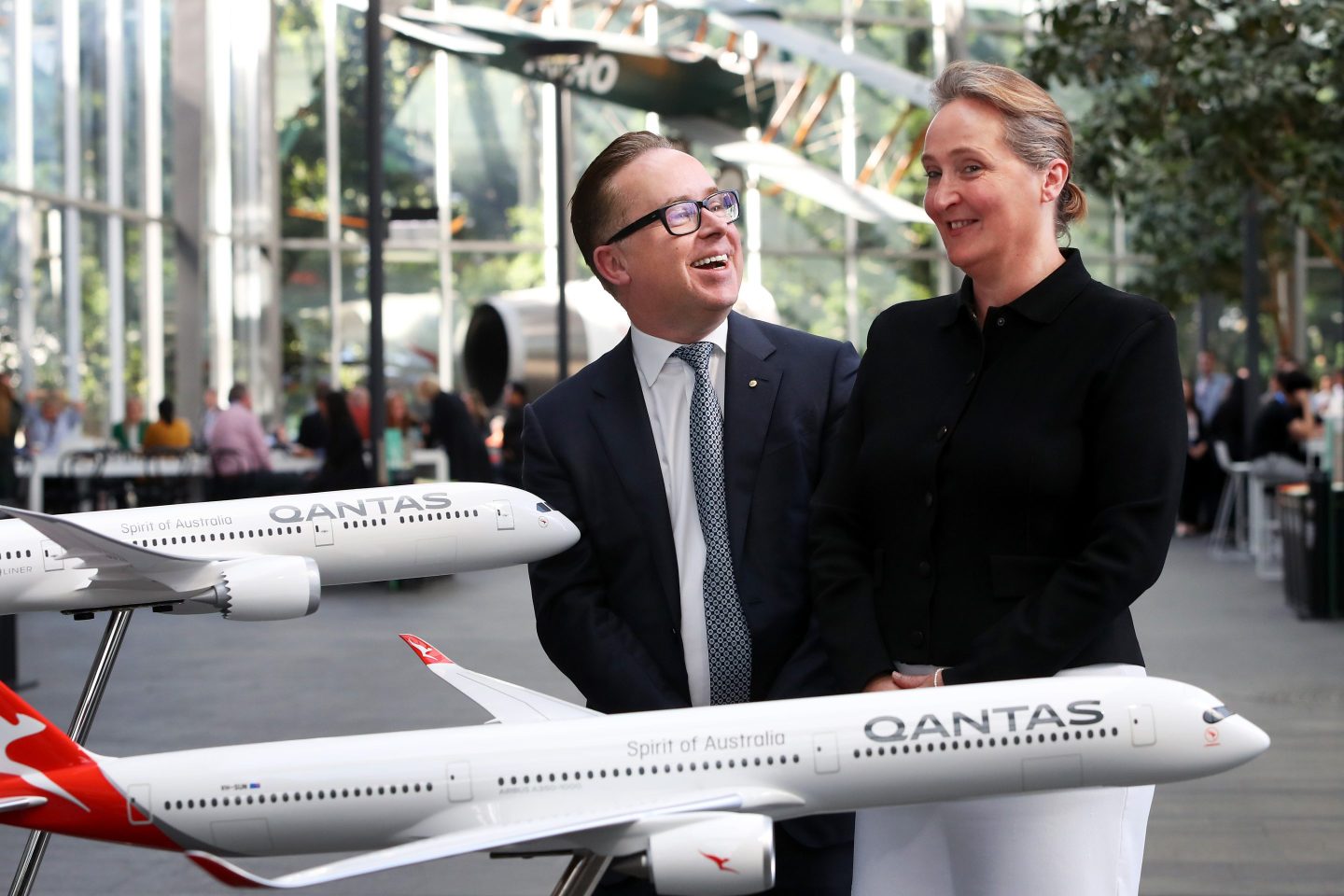 Alan Joyce, chief executive officer of Qantas Airways, left, and Vanessa Hudson, chief executive officer-designate of Qantas, pose for photographs during a news conference in Sydney, Australia, on Aug. 24, 2023.