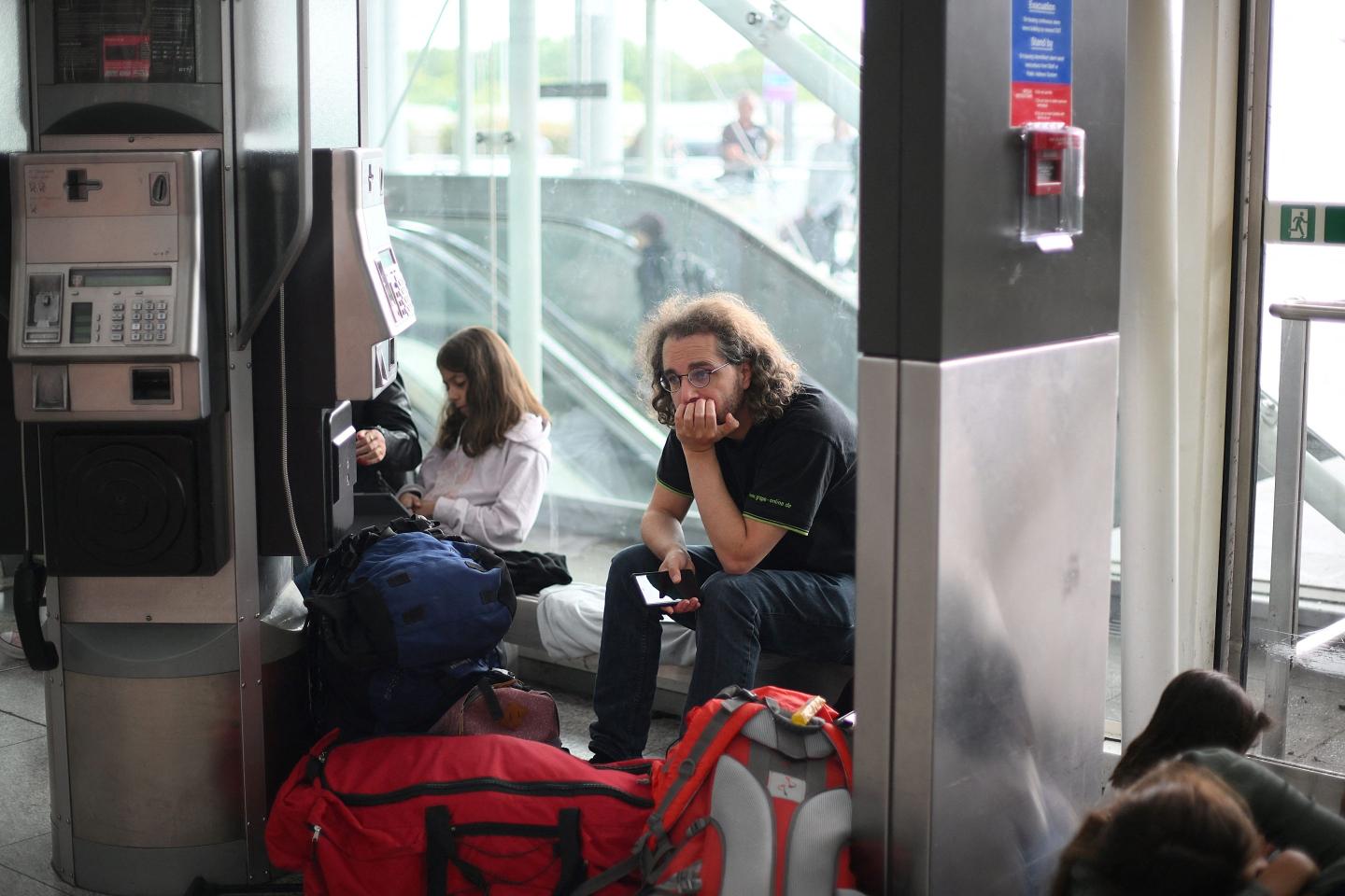 Passenger waits in an airport during a flight delay