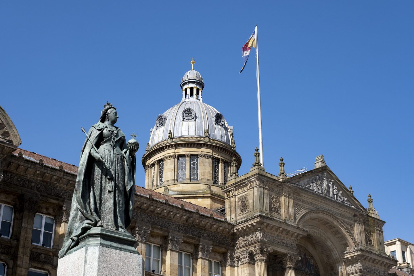 a picture of Queen Victoria's statue outside the Birmingham City Council Town Hall