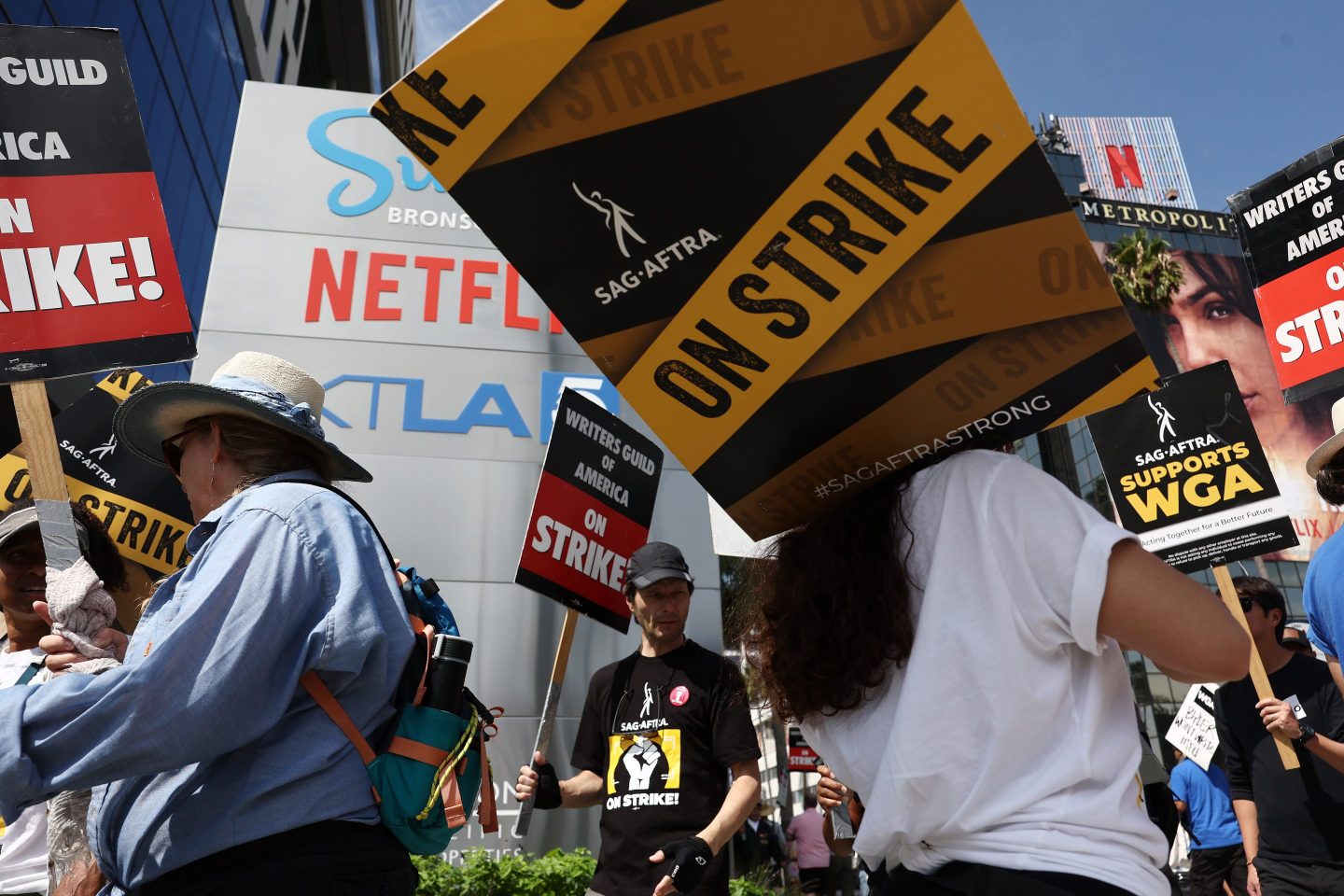 LOS ANGELES, CALIFORNIA &#8211; SEPTEMBER 22: Striking WGA (Writers Guild of America) members picket with striking SAG-AFTRA members outside Netflix studios on September 22, 2023 in Los Angeles, California. The Writers Guild of America and Alliance of Motion Picture and Television Producers (AMPTP) are reportedly meeting for a third straight day today in a new round of contract talks in the nearly five-months long writers strike.  (Photo by Mario Tama/Getty Images)