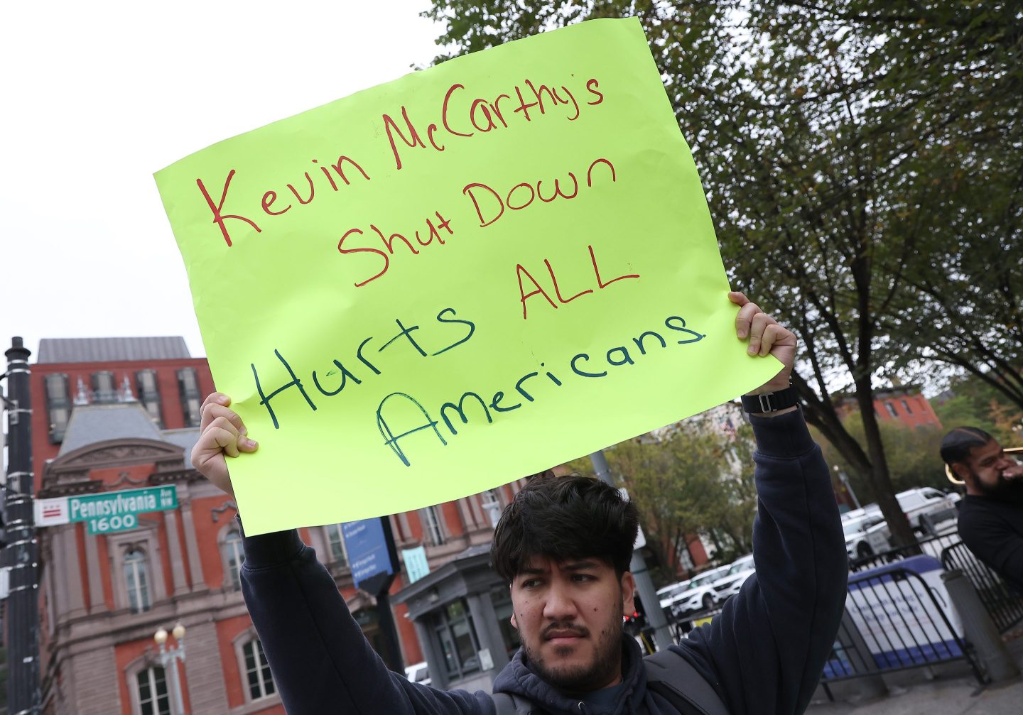 A demonstrator holds up a sign