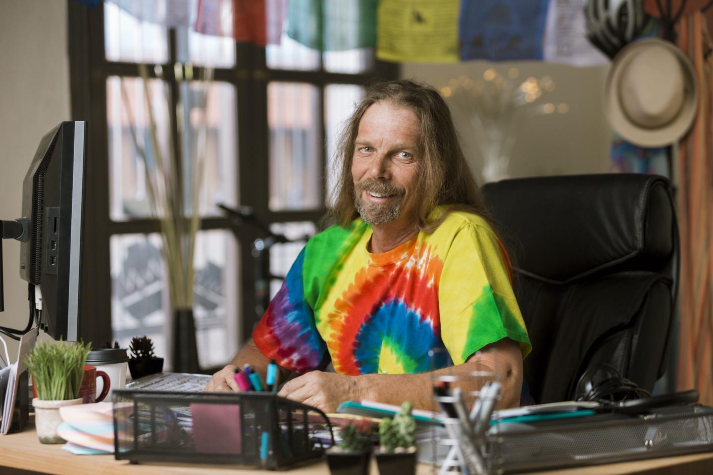 Man in office in tie dye