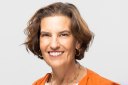 portrait of a woman in business professional clothing smiling