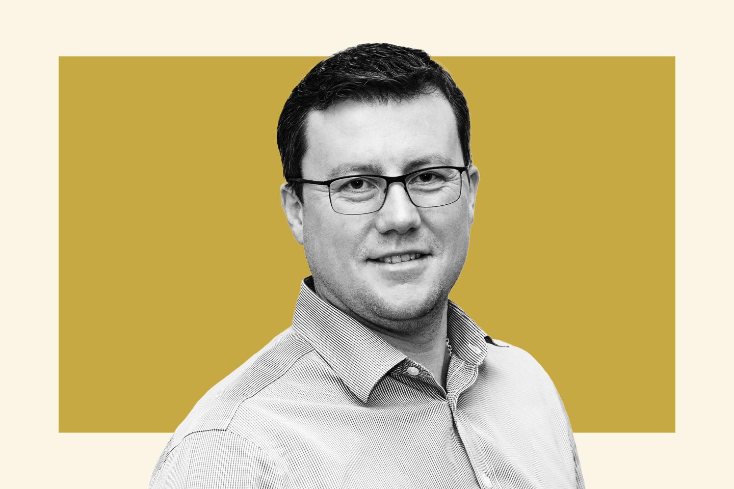 man in glasses and collared shirt
