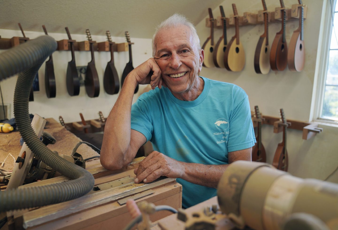 Mike Dulak, seen here in his mandolin workshop, is among the growing number of Americans who do not associate with any religious group.