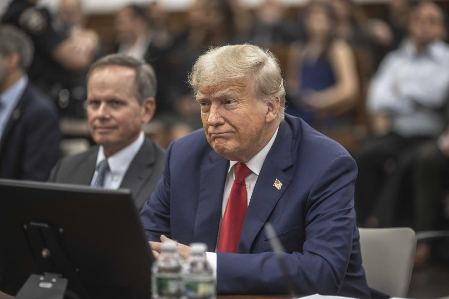 Trump hit with limited gag order after publishing disparaging Truth Social post about New York court clerk in business fraud case