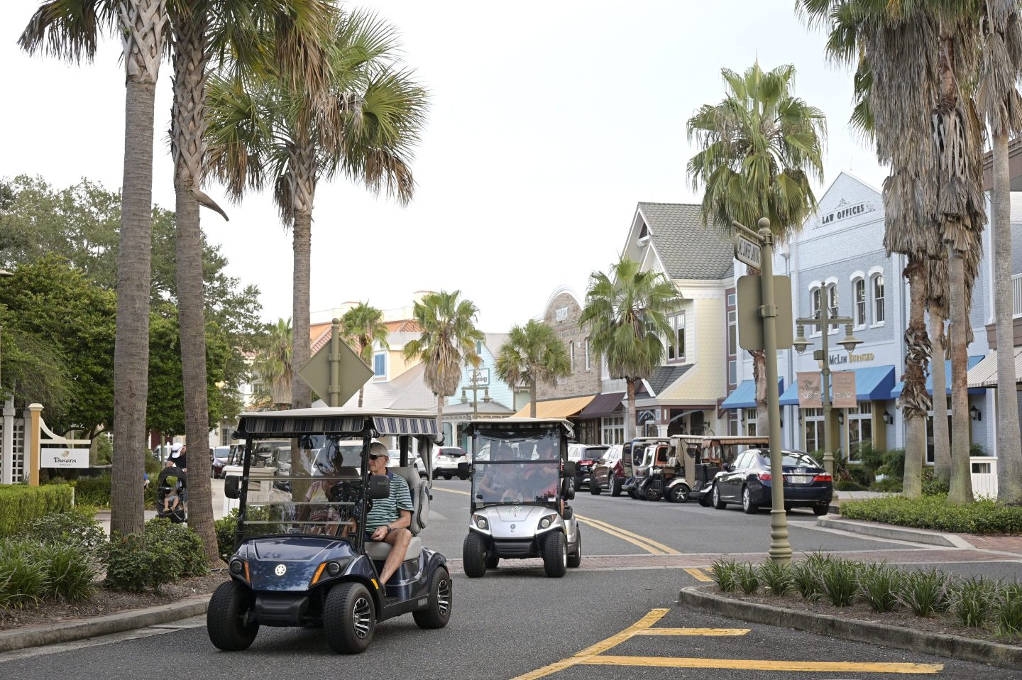 Residents drive golf carts in The Villages retirement community in Florida.