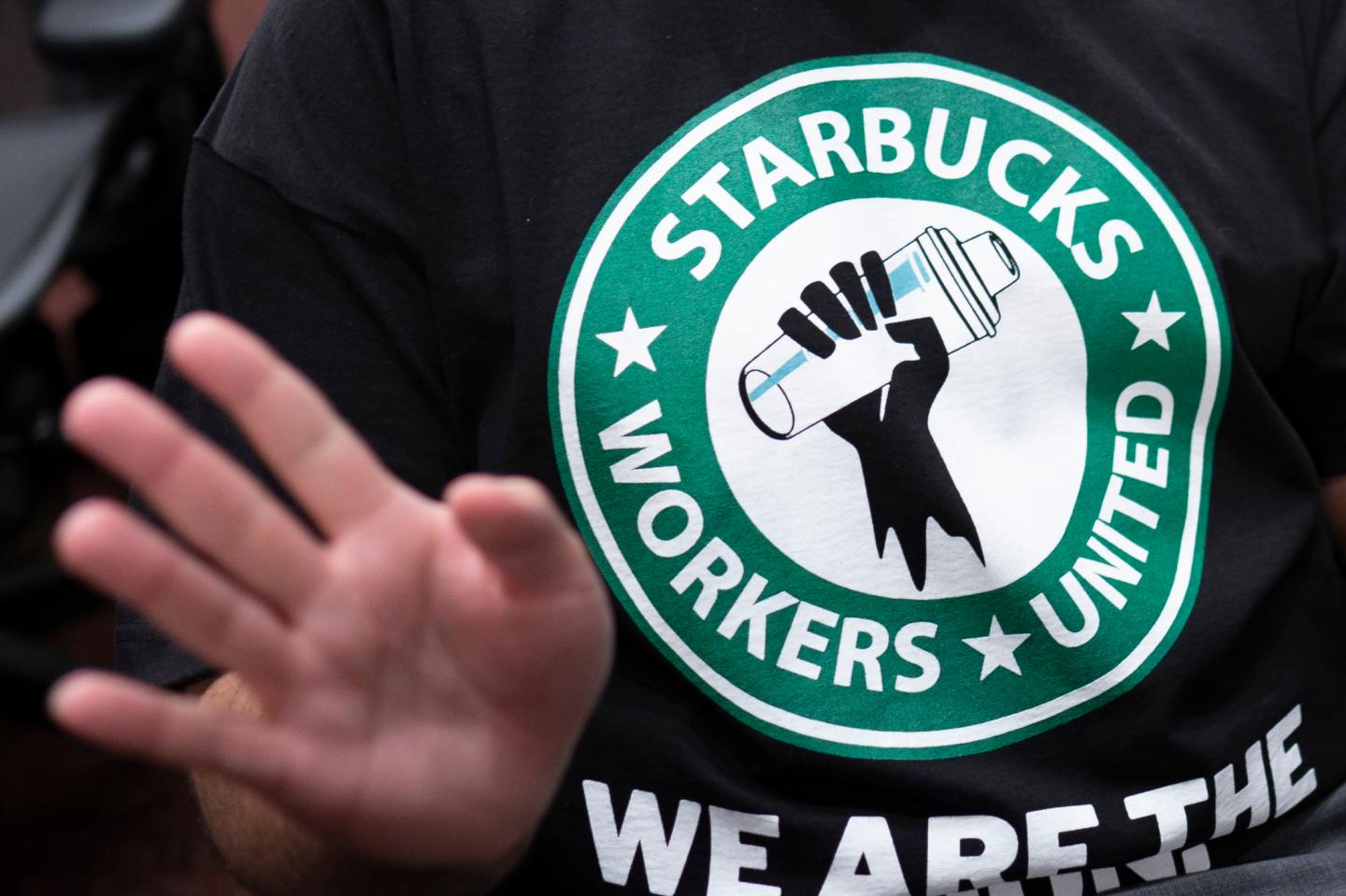Starbucks Workers United logo featured on a black t-shirt