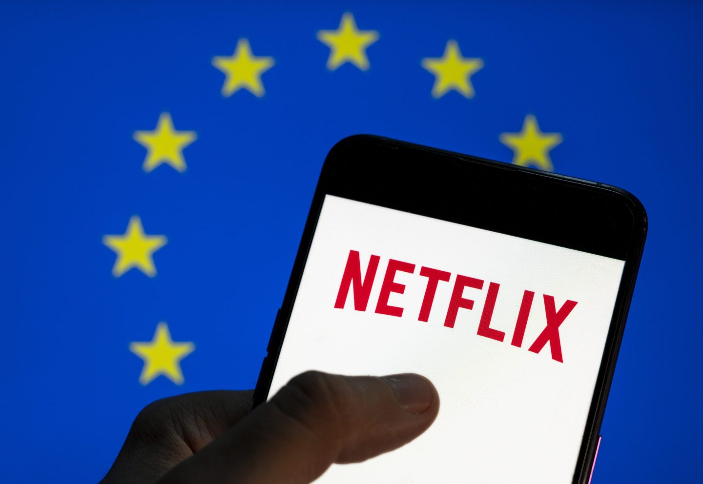 In this photo illustration the American global on-demand Internet streaming media provider Netflix logo is seen on an Android mobile device screen with the European Union (EU) flag in the background.