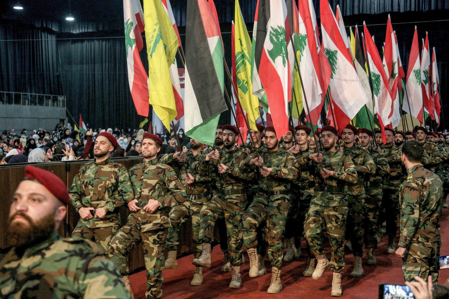 Pro-Iran Hezbollah militants marching at a rally in Beirut.