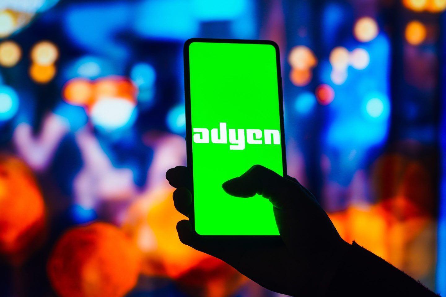 adyen app held on a smartphone