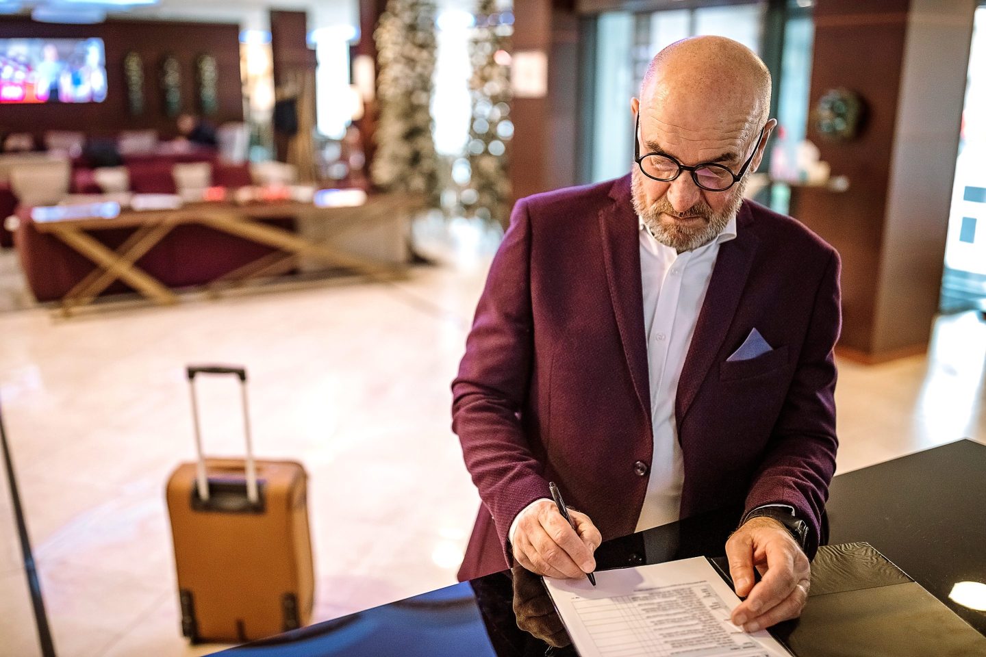 You can check in any time you like—but good luck finding a person to help.